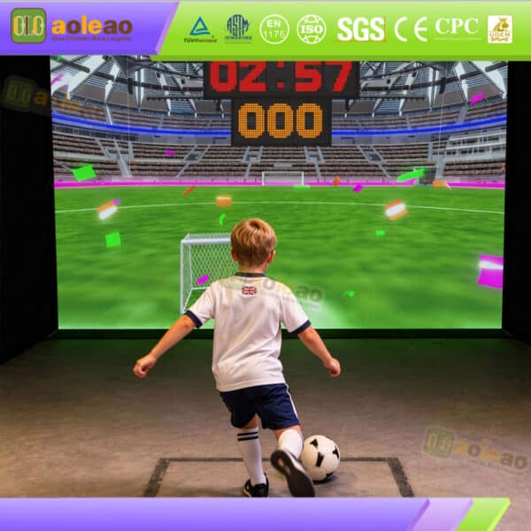 Child kicking a soccer ball toward a digital football stadium goal in an interactive arcade simulator game