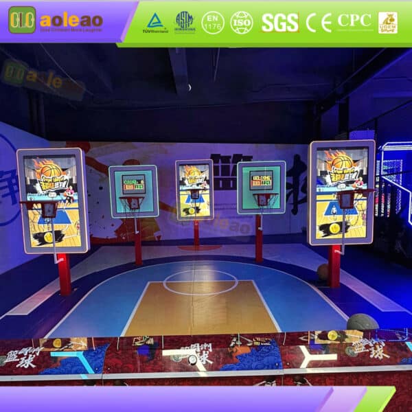 Indoor basketball arcade game area featuring multiple electronic hoop stations and colorful basketball court markings