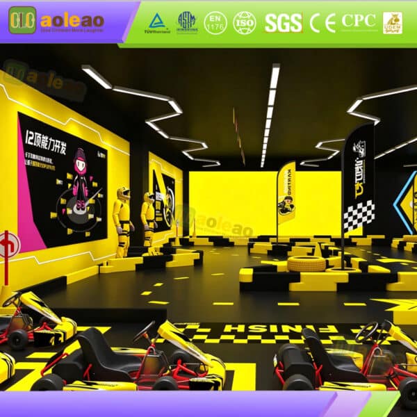 Indoor go kart track with red racing karts, black and yellow track barriers, checkered start line and themed decorations